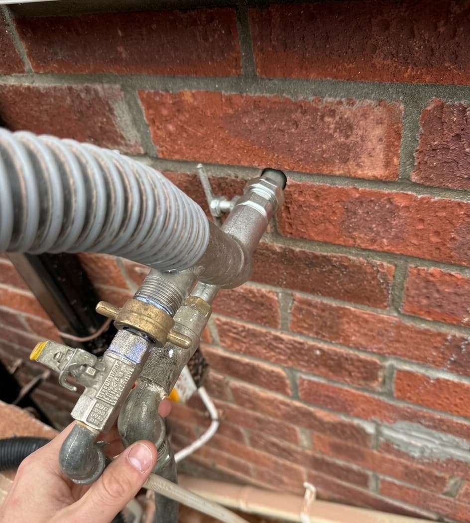 Cavity wall insulation injection in progress