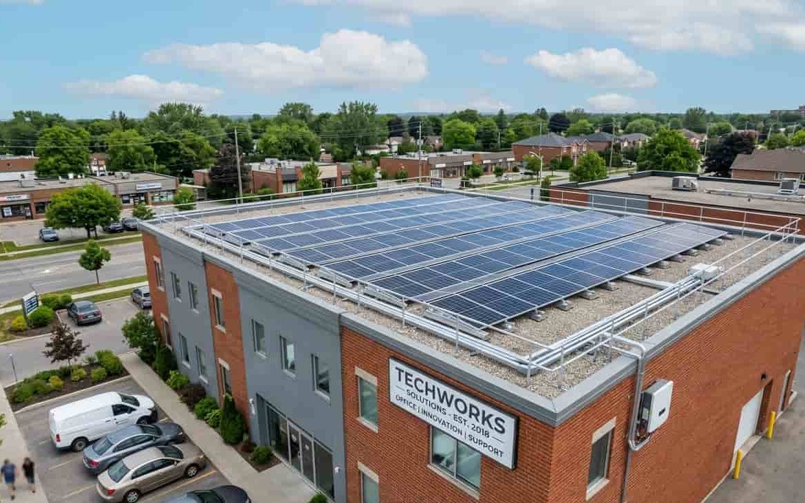Large-scale commercial solar PV array on a business premises roof