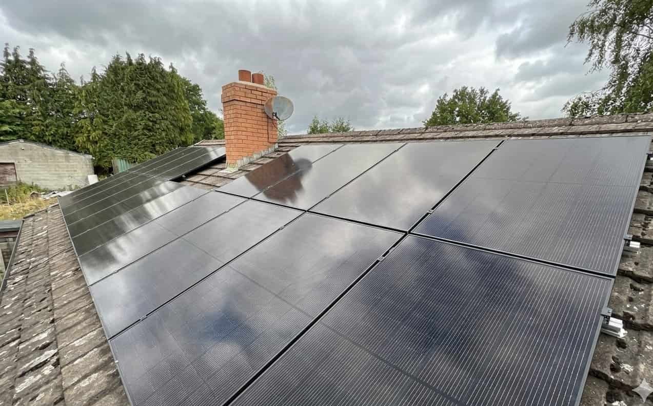 Completed solar panel installation on a Welsh home, all-black Trina panels on a pitched roof